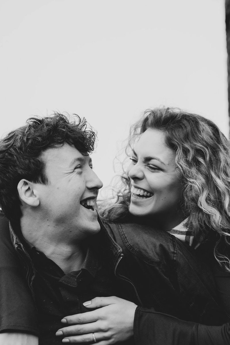 Black and white close-up of a couple laughing together