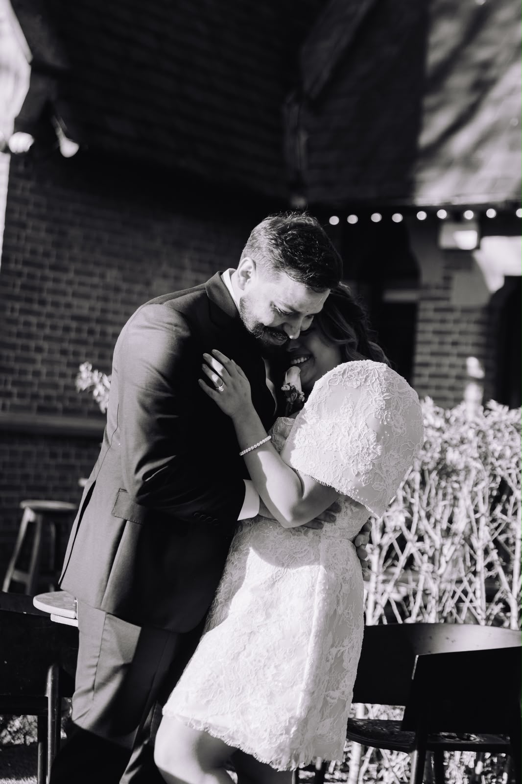 Couple dancing closely in black and white