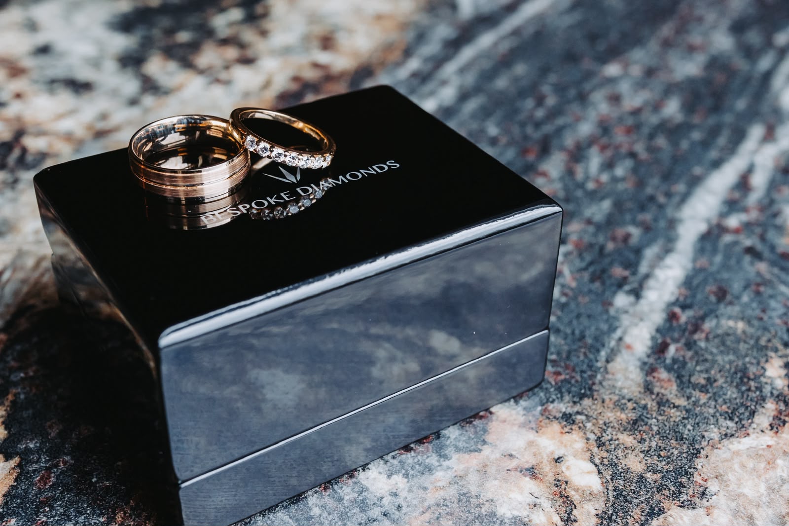 Wedding rings resting on a ring box